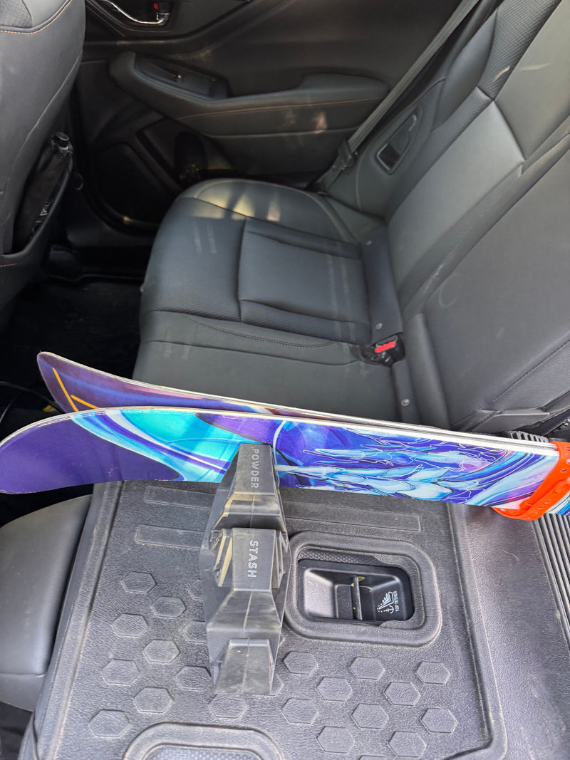Powder Stash slots holding skis for tuning